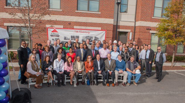 Officials from the City of Alexandria, ARHA, EYA and community and business leaders at the Old Town Commons Completion Ceremony